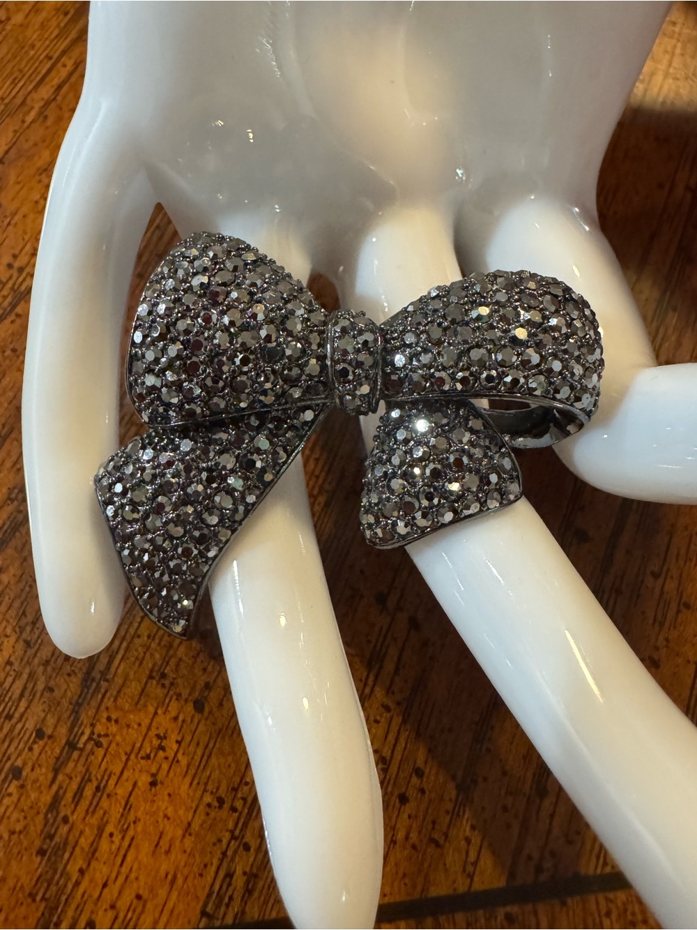 Gunmetal gray crystal and metal bow brooch, EUC. Super-sparkly!
